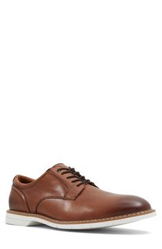 A burnished leather upper and streamlined silhouette add timeless sophistication to a sleek derby grounded by a durable sole. Lace-up style Leather upper/textile and synthetic lining/synthetic sole Imported Brown Low-top Dress Shoes For Work, Leather Derby With Textured Sole For Business Casual, Brown Leather Derby For Business Casual, Brown Leather Derby Shoes For Business Casual, Leather Derby Shoes For Business Casual, Masculine Leather Derby For Business Casual, Brown Derby Shoes With Branded Insole For Business Casual, Summer Wardrobe Essentials, Wedding Guest Shoes