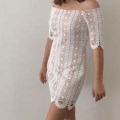 Flirty And Romantic, This White Floral Pattern Crochet Lace Dress Has A Hollowed Out Design Over A Nude Color Lining. Fitted Bodice With Rubber Trim To Keep It In Place. Bodycon-Style Throughout With A Tiny Bit Of Stretch For Comfort. Pretty Scalloped Hem, Attractive Half Sleeves And Exposed Rear Zipper. Wear This Elegant Dress To Any Formal Or Semi-Formal Occasions Like Bridal, Cocktail Parties, Ceremonies, Banquets, Festivals, Graduations, Etc. Hand Wash; Low Iron (100% Polyester Shell & Linin Elegant Crochet Lace Dress For Vacation, Lace Mini Dress With Crochet Details, Chic Lace Dress With Crochet Details, Fitted Crochet Dress With Crochet Trim For Party, Off-shoulder Mini Dress With Lace Trim For Beach, Spring White Lace Dress With Hollow Out Details, Chic Fitted Mini Dress With Crochet Lace, Elegant Mini Crochet Dress For Vacation, Elegant Crochet Mini Dress For Vacation