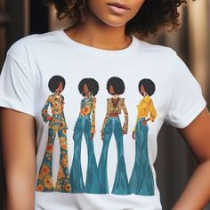 This ADULT UNISEX short sleeve shirt features four black women sporting afros and bellbottoms, evoking a nostalgic 70s vibe. Crafted from soft 100% cotton, this tee is comfortable and ready to wear for any occasion. Available in a variety of sizes and colors, it also boasts side seams for added durability. Refer to the included measurement chart to ensure the perfect fit. An excellent gift for those who appreciate retro style and cultural heritage. Shop The Trini Gee for more: https://www.etsy.com/shop/thetrinigee Fitted Retro Print Crew Neck Tops, Trendy Short Sleeve Top With Retro Print, Fitted Short Sleeve Shirt With Retro Print, Casual Fitted Tops With Retro Print, Casual Fitted Retro Print Tops, Groovy Relaxed Fit Short Sleeve Tops, Fitted Cotton Groovy Tops, Groovy Short Sleeve Top With Graphic Print, Groovy Graphic Print Top With Short Sleeves