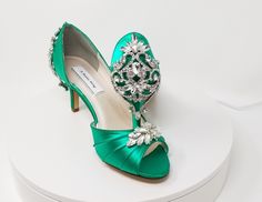 "Emerald Green Wedding Shoes with a sparkling Crystal front applique and crystal back design. Perfect shoes for your special day. The listing picture shoes a comfortable 2 1/2 inch heel (also available in 1 3/4 inch heel ). The shoes in the listing have been dyed Emerald Green, but is also available in over 100 different colors as well as the option of sending us a sample to color match for you! If you would like a different heel size than the listing heel size of 2 1/2 inches, please leave us a Emerald Green Wedding Shoes, Green Bridal Shoes, Emerald Green Heels, Emerald Green Wedding, Emerald Green Weddings, Green Heels, Crystal Shoes, Womens Wedding Shoes, Green Wedding Shoes