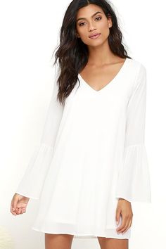 a white dress with bell sleeves is on sale