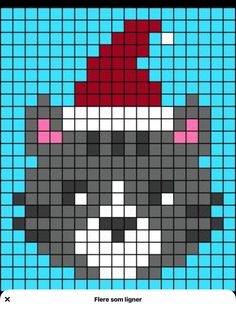 a cross stitch pattern with a cat wearing a santa hat on it's head