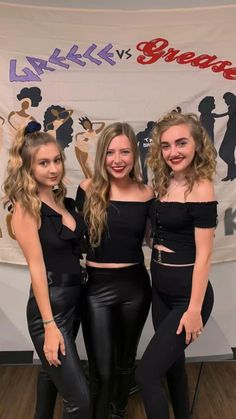 three girls in black outfits posing for the camera with their hands on their hipss