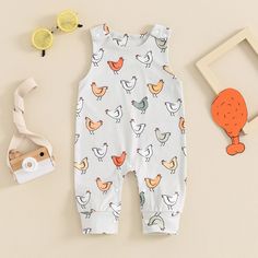 Dress your little one in our CHICKENS Jumpsuit and watch them transform into a cute little chickadee! Ideal for both baby girls and boys, this outfit boasts a playful chicken design that will make everyone "cluck" with joy. Your baby will be both snug and stylish all day long. Spring Cartoon Print Onesie For Playwear, Spring Onesie With Cartoon Print For Playwear, White Printed Playful Jumpsuits And Rompers, White Cartoon Print Jumpsuits And Rompers For Spring, White Cartoon Print Jumpsuits For Spring, Playful Bubble Romper With Cartoon Print For Playtime, Playful Cartoon Print Bubble Romper For Playtime, Spring Cartoon Print Jumpsuits And Rompers For Playtime, Spring Playtime Cartoon Print Jumpsuits And Rompers