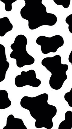 a black and white cow print pattern that looks like it has spots on the skin