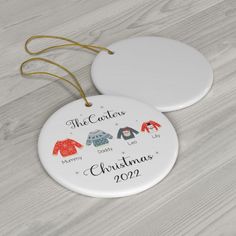 personalized christmas ornament for the family with three sweaters hanging from it