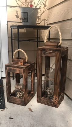 two wooden lanterns sitting next to each other