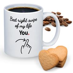 a white coffee mug with the words best right cup of my life you on it next to two heart shaped cookies