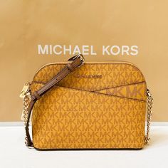 New With Tag Michael Kors Jet Set Travel Medium Dome Crossbody Bag Mk Signature Pvc Leather Yellow Brown Marigold Multi 100% Authentic Retail: $328.00 Plus Tax **Please See The Measurement For The Size** No Dust Bag Michael Kors Logo At Front 1 Slip In Pocket At Front Zip Top Closure Gold Toned Hardware Custom Fabric Lining 2 Slip-In Pockets 8.75" (L) X 7"(H) X 3.5"(D) Strap: 20"-23" Very Clean, Smoke-Free And Pet-Free Environment. Gold Crossbody Bag With Logo, Gold Logo Crossbody Bag, Yellow Michael Kors Travel Bag, Yellow Crossbody Bag With Branded Hardware, Michael Kors Yellow Travel Shoulder Bag, Michael Kors Yellow Shoulder Bag For Travel, Yellow Michael Kors Leather Shoulder Bag, Michael Kors Yellow Leather Shoulder Bag, Mk Sling Bag