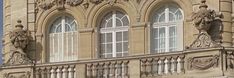 an old building with ornate windows and balconies