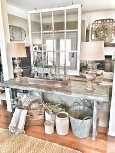 a room filled with lots of different types of pots and baskets on top of a table