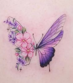 a purple butterfly with pink flowers on it's back shoulder and wings is shown