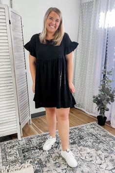 Effortlessly chic, this textured mini dress is bound to make a statement. Featuring a round neck, sleeveless design and playful ruffle detail at the shoulders, it's the perfect mix of style and comfort. Complete with side pockets and a lined interior, this dress is perfect for any occasion. A textured flowy dress with ruffle sleeves for women. Morgan is wearing Large Melissa is wearing Small Chic Spring Dresses With Textured Fabric, Textured Summer Dress, Textured Summer Dresses, Flowy Mini Dress With Ruffle Sleeves, Casual Style, Casual A-line Mini Dress With Smocked Bodice, Sleeves For Women, Bohemian Mini Dress With Smocked Bodice And V-neck, Rayon V-neck Mini Dress With Ruffles, Bohemian A-line Mini Dress With Ruffles