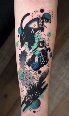 a person with a tattoo on their leg that has cats and birds all over it