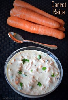 carrots are next to a bowl of dip