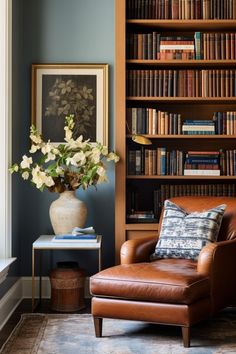 a living room filled with lots of books and furniture