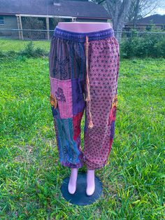 Handmade boho patchwork pant ethically made multicolored- multi patched harem pants 100 % organic cotton handmade drawstring with elastic waistband Stylish eye catching designs one size free size Waist unstretch 28 Waist stretched 50 Length 40/41 Hip 56 Thighs around 29/30 Inseam 29/30 Rise 16 Bohemian Cotton Pants With Floral Patchwork, Hippie Floral Patchwork Bottoms For Festival, Bohemian Cotton Bottoms With Floral Patchwork, Hippie Cotton Bottoms With Floral Patchwork, Pink Cotton Hippie Bottoms, Pink Hippie Cotton Bottoms, Pink Cotton Patchwork Pants, Bohemian Floral Patchwork Bottoms For Festival, Festival Cotton Patchwork Harem Pants