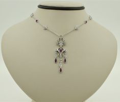 "Stunning vintage 1980s handmade 14K solid white gold round cut natural diamonds and heart shaped and marquise cut natural rubies milgrain diamond by the yard necklace. Great gift for someone you love. Necklace length: 16\" The width of the bezel set heart shaped natural rubies approx.: 4mm Width of heart shaped charms with diamonds attached to the chain approx.: 5.34mm Pendant length approx.: 46mm Pendant width approx.: 12.8mm Diamond cut cable chain thickness: 1.1mm Total diamond weight approx Rubies Necklace, Diamond By The Yard, Ruby Necklace, Wedding Jewellery Necklace, Natural Ruby, Marquise Cut, Wedding Necklace, Necklace Length, Diamond Cut