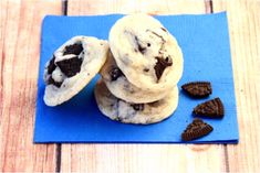 chocolate chip cookies and oreo cookies on a blue napkin