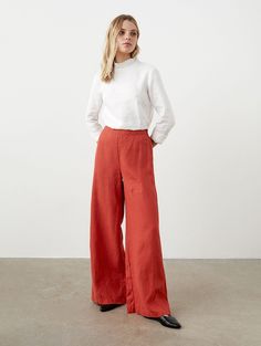 "Accentuated waistline and wide, flowy leg style -- enjoy effortless elegance with these flared linen pants. High waist is emphasized by very clean front side. No pockets, no buttons or straps, just hidden zipper to maintain this cleanliness. Very similar to our beloved pants WANTED, just slightly less flared. STYLE DETAILS * Regular fit * Flare cut * High waist with elastic back line * Hidden zipper * No pockets * Full length * Made from medium linen SIZES & COLORS IN THE PICTURES * Model wears size S in color Rooibos and size S in color Dark Grey. She is 176 cm (5'9\"). Bust - 83 cm (33\"), waist - 60 cm (24\"), hips - 89 cm (35\").  NOTES ON SIZING & COLORS * Please note that linen shrinkage during the softening process cannot be predicted precisely. Therefore, each piece in the same si Linen Wide Leg Pants For Fall, Fall Linen Wide Leg Pants, Wide Leg Linen Pants For Fall, Flared Linen Pants, Flare Palazzo Pants, Flared Palazzo, Linen Shirts Women, Pants High Waisted, Trousers For Women