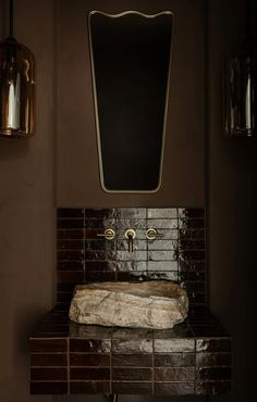 a bathroom sink with a mirror above it