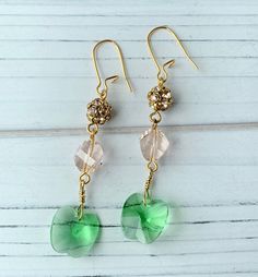 Sophisticated dangle earring with Swarovski green apple faceted crystal and blush Swarovski pave that add eye catching shimmer to this stunning set. Lightweight earrings with a 2 3/4 inch drop on gold plated, nickel free ear wires. Makes a great gift or a little something special to treat yourself with. Thank you for visiting my Etsy! Glamorous Green Teardrop Jewelry, May Birthstone Crystal Dangle Earrings For Party, Wedding Drop Earrings With Faceted Beads, Faceted Crystal Drop Earrings For Wedding, Elegant Green Earrings With Faceted Beads, Swarovski Crystal Drop Earrings, Earrings Inspiration, Granny Smith, Lightweight Earrings