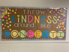 a bulletin board that says throw kindness around like confetti on the front wall