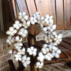 a wooden bench with a bunch of cotton on it