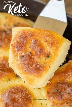 cheesey keto biscuits in a skillet with a spatula on the side