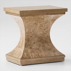 a wooden table with a square shaped base