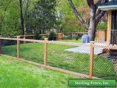 a fence that has been installed in front of a house with the words sterling fence, inc