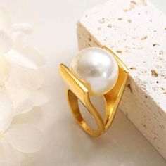 ✦ Embrace elegance with our Y-shaped ring featuring a lustrous pearl, available in luxurious gold or sleek silver. Crafted with sophistication and plated in radiant 18K gold, this ring exudes timeless charm and refined style. Elevate your ensemble with the delicate beauty of pearls, perfect for adding a touch of sophistication to any look.----------- DETAILS ------------ Color: Gold/ Silver- Ring Size: US 6, US 7, US 8- Width: 1.8cm- Materials: 18K Gold Plated, Titanium Steel, Pearl- SKU: A166 Gothic Minimalist, Pearl Cocktail Ring, Elegant Gothic, Crystal Hoop Earrings, Nose Rings Hoop, Delicate Beauty, Refined Style, Fashion Jewelry Earrings, Bridesmaid Jewelry