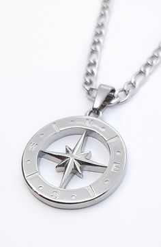 North star pendant necklace. Compass necklace. Fashion accessory or travel charm. Mirror polished finish. Simple, timeless piece to suit any outfit. Great accessory for men or women. Pendant 25mm across. With 3mm box chain or 4mm figaro chain. Available in various lengths to suit all tastes. Premium  stainless steel -  * Durable * Waterproof * Hypoallergenic * Tarnish and scratch resistant * High strength * Lasting colour * Shiny  * Comfortable to wear * Affordable  We keep packaging to a minimu Silver Compass Necklace, Compass Necklace Silver, North Star Pendant, Vintage Compass, North Star Necklace, Mens Keychains, Star Necklace Silver, Compass Pendant, Travel Charms