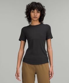 This lightweight everyday top has just the right softness, just the right stretch, and a snug fit that feels like a second skin. Designed for On the Move. Contours your body:Sits below the waistband for moderate, everyday coverage. 'Wash with like colours', 'Machine wash cold', 'Do not bleach', 'Tumble dry low', 'Do not iron', 'Do not dry clean', 'Imported'. Soft, Ribbed Modal Fabric. Body: 94% Lenzing modal, 6% Elastane. Versatile Everyday Tops By Lululemon, Versatile Everyday Lululemon Tops, Lululemon Short Sleeve T-shirt For Everyday, Casual Lululemon T-shirt For Everyday, Lululemon Casual Crew Neck T-shirt, Casual Lululemon Everyday T-shirt, Lululemon Short Sleeve T-shirt, Lululemon Short Sleeve T-shirt For Summer, Lululemon Summer T-shirt With Short Sleeves