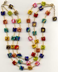 Square Glass Beads Jewelry Ideas, Multicolor Faceted Beads For Celebration, Multicolor Faceted Beads Necklace For Celebration, Multicolor Oval Beads Necklace For Festive Occasions, Elegant Multicolor Oval Beads Necklace, Handmade Multicolor Murano Glass Beads, Multicolor Large Beads For Celebrations, Elegant Multicolor Glass Beaded Necklaces, Elegant Multicolor Beaded Gems And Cabochons