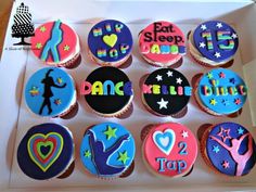 twelve decorated cupcakes in a box with the words eat sleep dance written on them