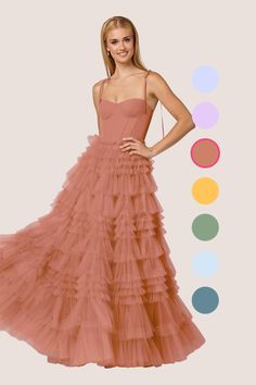 This floor length dress features a sweetheart corseted bodice, bow tie straps, and a tulle tier ball gown skirt. Tiered Gown, Wedding Aesthetics, Gown Skirt, Tulle Bridesmaid Dress, Chiffon Bridesmaid Dresses, Floor Length Dress, Ball Gown Skirt, Mai Tai, Dresses Party