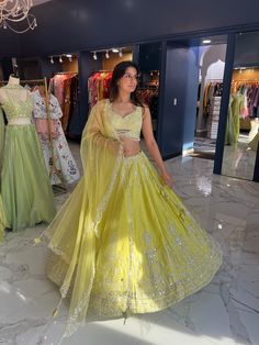 Color: Vibrant lemon yellow Fabric: Luxurious, with a soft sheen cotton silk Blouse: Sleeveless design Delicate beadwork and silver embroidery Skirt: Flowing, full-length design Intricate silver embroidery with elaborate patterns Dupatta: Matching yellow with subtle detailing Style: Perfect blend of traditional elegance with a modern twist Ideal For: Weddings, festivals, and celebratory events Customizable in other colors READY TO SHIP , Please WHATSAPP +1 (945) 444-2194 for more info. Blouse Sleeveless Design, Yellow Lehenga Choli, Crop Top Suit, Sharara Suits, Yellow Lehenga, Embroidery Skirt, Silver Embroidery, Basic Mehndi Designs, Blouse Sleeveless