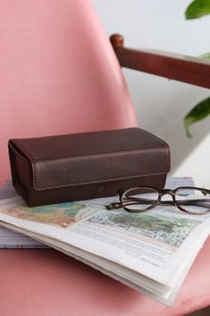 Created by our masterful artisans with the finest materials and outstanding attention to detail, our menssunglasses case is the perfect accessory along your journey. A semi hard case with four compartments protects your glasses from scratches and shocks thrown your way. Easy to carry, individual padded dividers, wide opening, and magnetic access closure. Simple, sophisticated, and practical display case sunglasses. Portable Leather Travel Cases, Rectangular Cases For Everyday Use, Portable Travel Case, Rectangular Travel Case With Pen Slots, Rectangular Bags With Protective Case For Everyday, Everyday Rectangular Bags With Protective Case, Classic Rectangular Travel Organizers, Leather Travel Cases With Pen Slots, Brown Travel Wallet Rectangular Case