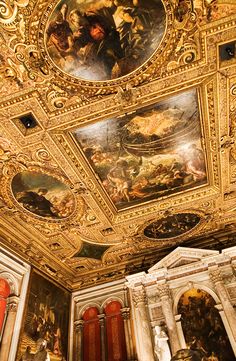 an ornate ceiling with paintings on it