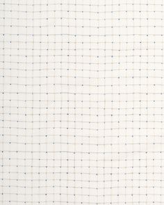 a white and blue checkered fabric with small dots