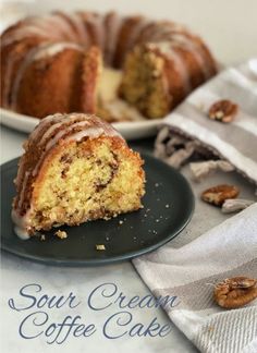 a bundt cake with icing and pecans on a plate next to it