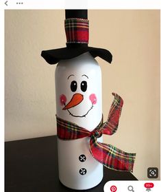 a snowman canister sitting on top of a table