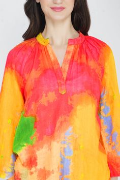 A Tie Dye Tunic is the perfect piece to take you from the house to the beach and right out to lunch! Comfy but oh-so-chic, this Tie Dye Tunic is a great addition to a basic wardrobe. It’s a statement piece that turns heads in bold colors of neon green, fuchsia, sunshine yellow and vibrant orange. Pair with sandals and white jeans for a look that’s fresh and fun. Short Tunic Tie Dye in Multi Colors Mandarin Collar 3/4th Sleeves Midi Length Loose Fit Made in Cotton Double Gauge Fabric Colorful Beachwear Tops For The Beach, Vibrant Tops For Beach Season Vacation, Yellow Top For Beach Party In Spring, Vibrant Multicolor Beach Top, Yellow Top For Spring Beach Party, Colorful Summer Beach Tops, Vibrant Cotton Tops For Beach, Colorful Summer Beachwear Tops, Colorful Beachwear Tops For Summer