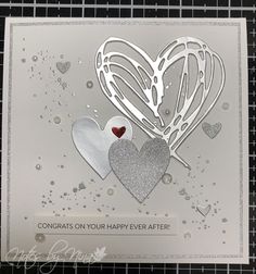 a close up of a card with two hearts and the words congrats on your happy ever after