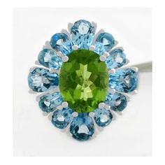 Karat : .925 Sterling Silver Gemstones : 1 Genuine Peridot - 3.15 Carats Peridot Grades, Hue . . . Olive Green Tone . . . Medium Dark Saturation . . . Vivid Cut . . . Very Good No Inclusions Or Flaws 12 Genuine Blue Topaz Total Ct Weight : 9.20 Carats Blue Topaz Grades, Hue . . . Sky Blue Tone . . . Medium Dark Saturation . . . Vivid Cut . . . Very Good No Inclusions Or Flaws Setting : Prong Shape : Oval & Pear Net Weight : 5.3 Grams Size : 7 Dimensions : 20 Mm (0.78") X 16 Mm (0.63") - Top Sett Green Multi-stone Topaz Ring For Formal Occasions, Formal Green Multi-stone Topaz Ring, Green Multi-stone Round Topaz Ring, Green Multi-stone Topaz Ring, Raw Sapphire Ring, Green Tone, Pretty Earrings, Blue Topaz Ring, Blue Tones