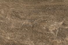 a close up view of a brown marble surface