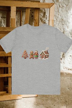 Get into the holiday spirit with this sweet gingerbread-inspired Christmas tee! Featuring adorable gingerbread cookies, a Christmas tree, and a cozy gingerbread house, this shirt is perfect for spreading holiday cheer. Whether you're baking cookies, attending a Christmas gathering, or just enjoying the season, this tee offers comfort and style. Pair it with your favorite jeans or leggings for a fun and festive look. Don’t forget to grab it as a gift for a friend or loved one! #ChristmasTees #HolidayFun #GingerbreadTee #ChristmasOutfit #CozyStyle #sweater  #Christmas Sweet Gingerbread, Baking Cookies, Christmas Gathering, Festive Look