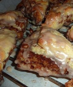 glazed donuts sitting on top of cooling racks