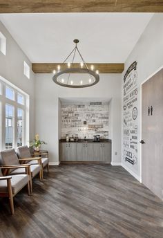 a room with wood floors and white walls